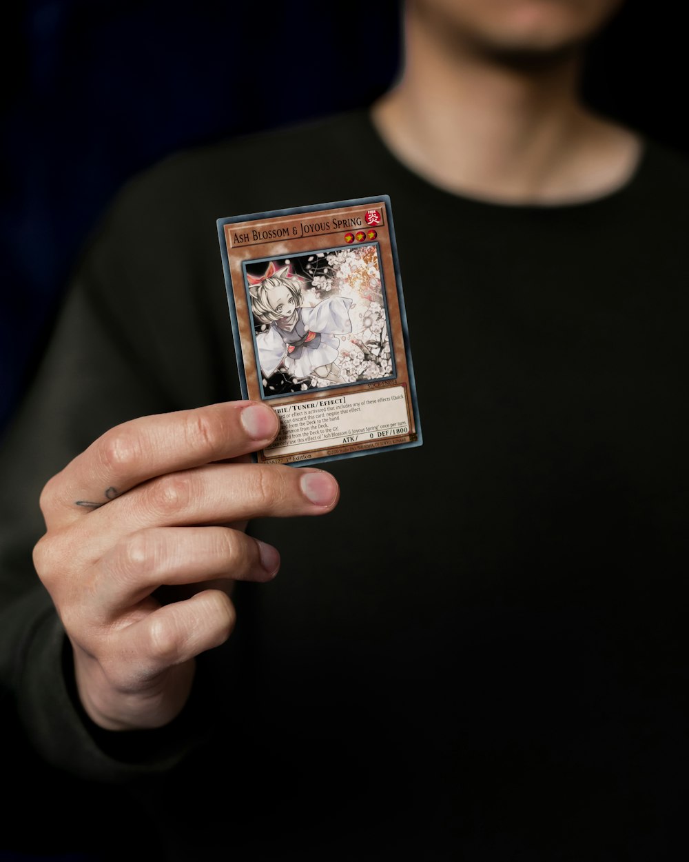 a person holding a card in their hand