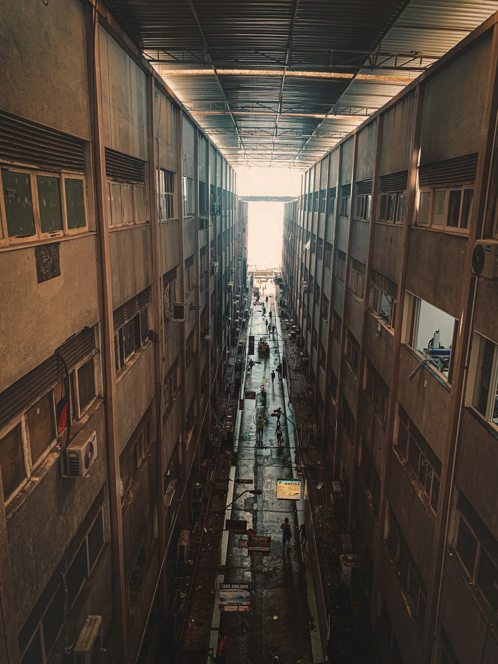 a very long narrow building with lots of windows