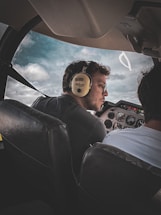 A friendly flight instructor answering questions during a lesson.