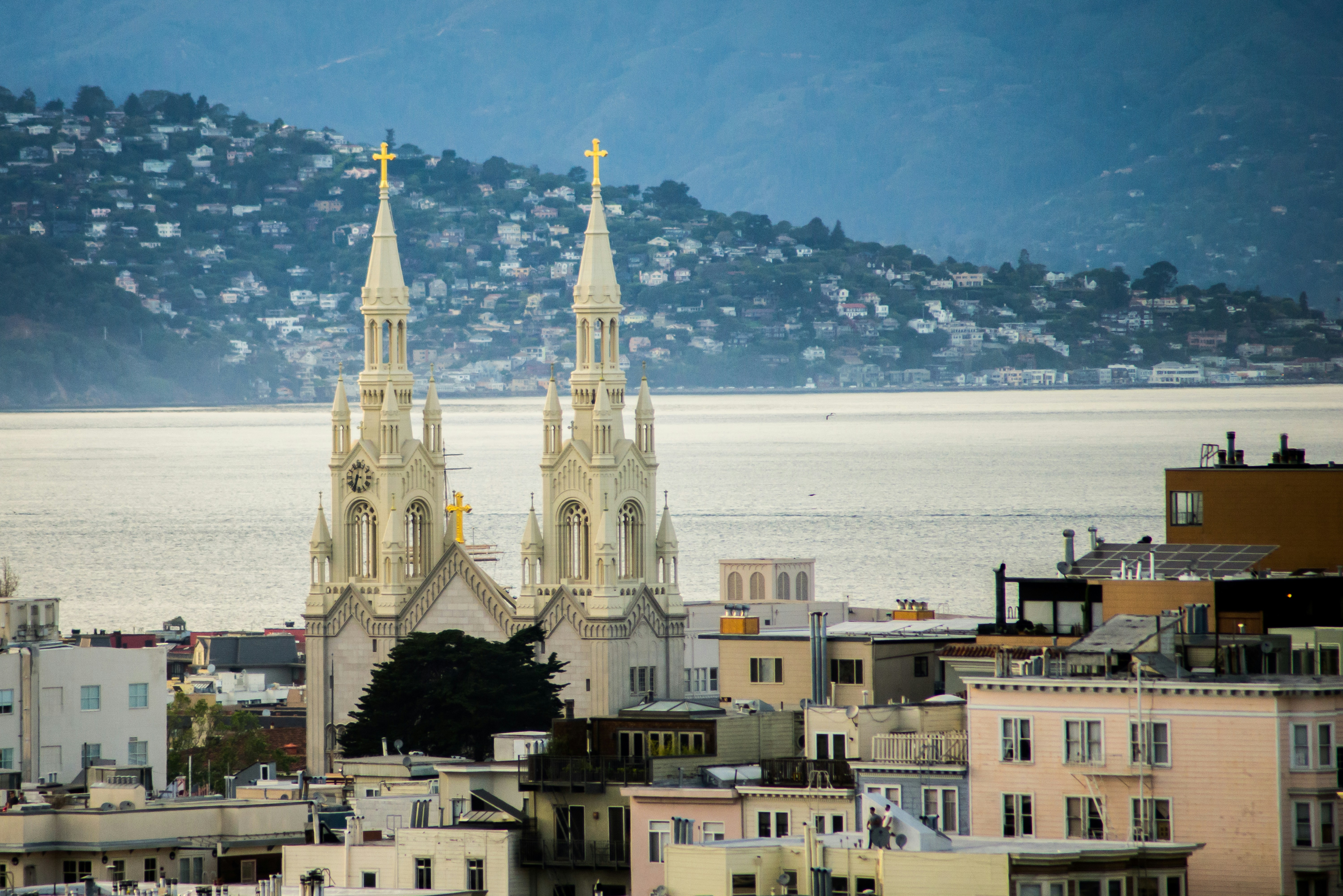 a view of a city with a large body of water in the background