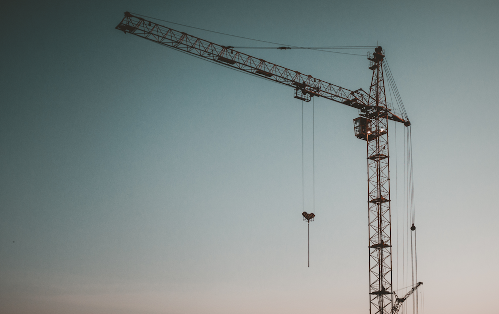 a large crane that is standing in the sky