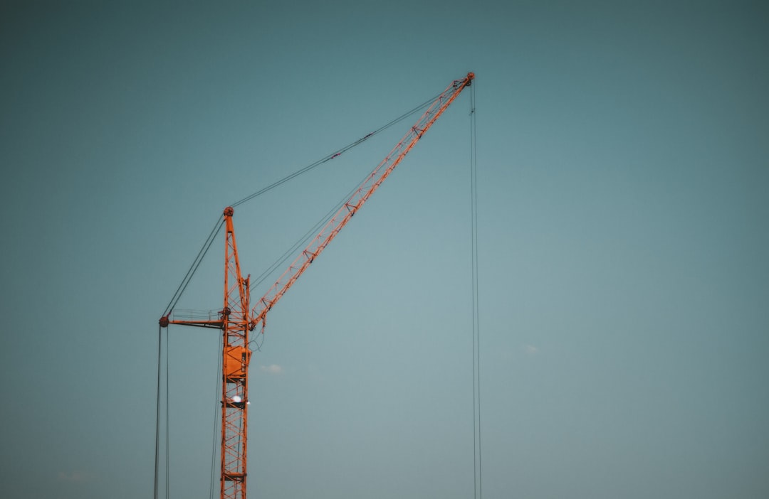a crane that is standing in the sky,