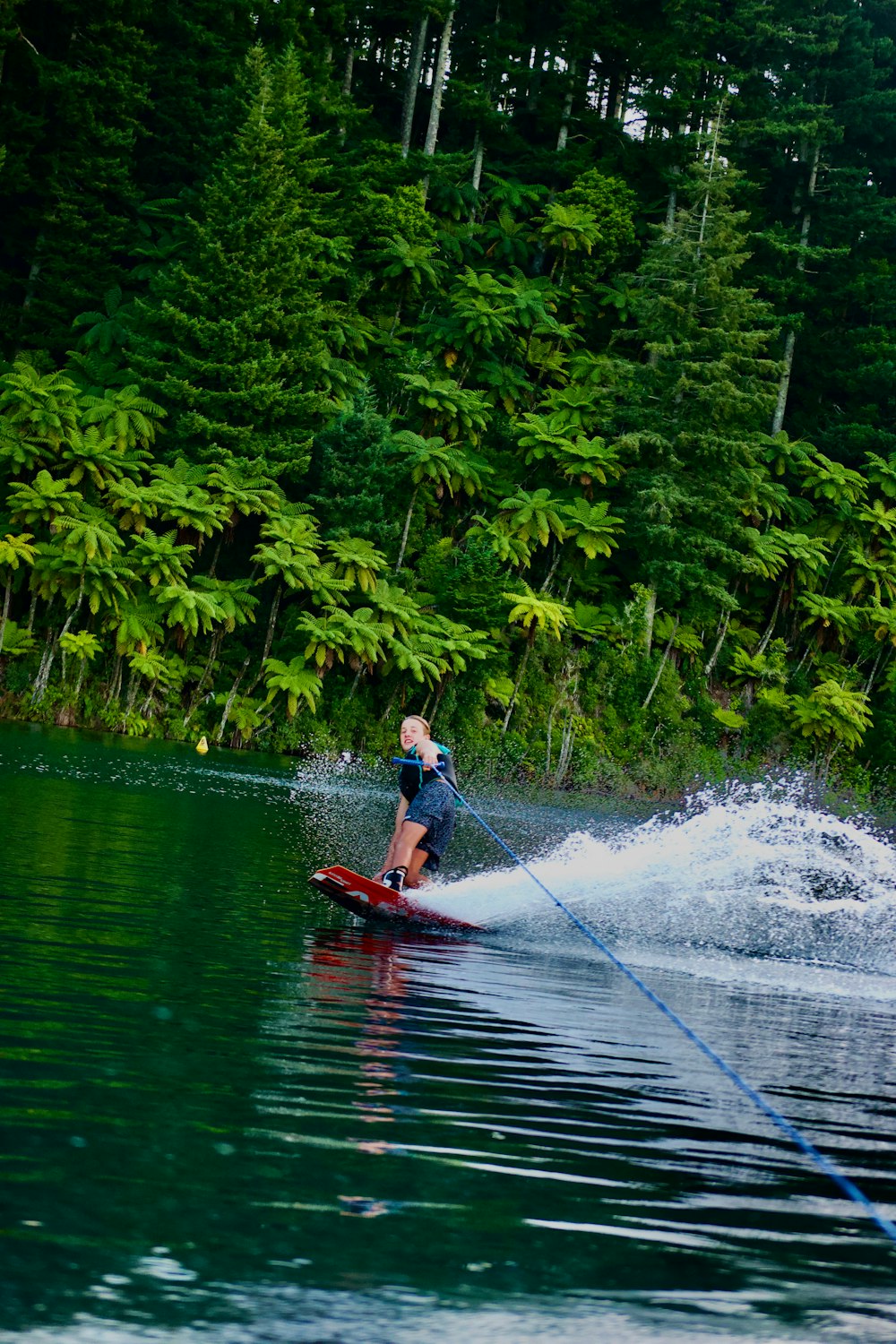 a person on a water ski being pulled by a boat