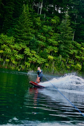 a person on a water ski being pulled by a boat