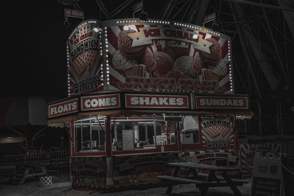 a dark picture of a food stand at night