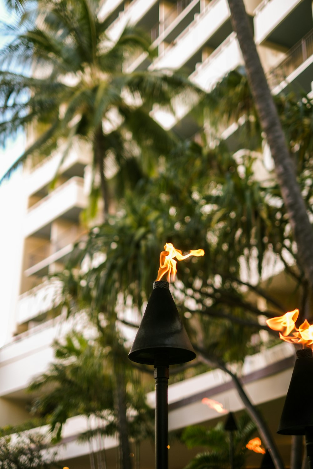 a street light with a building in the background