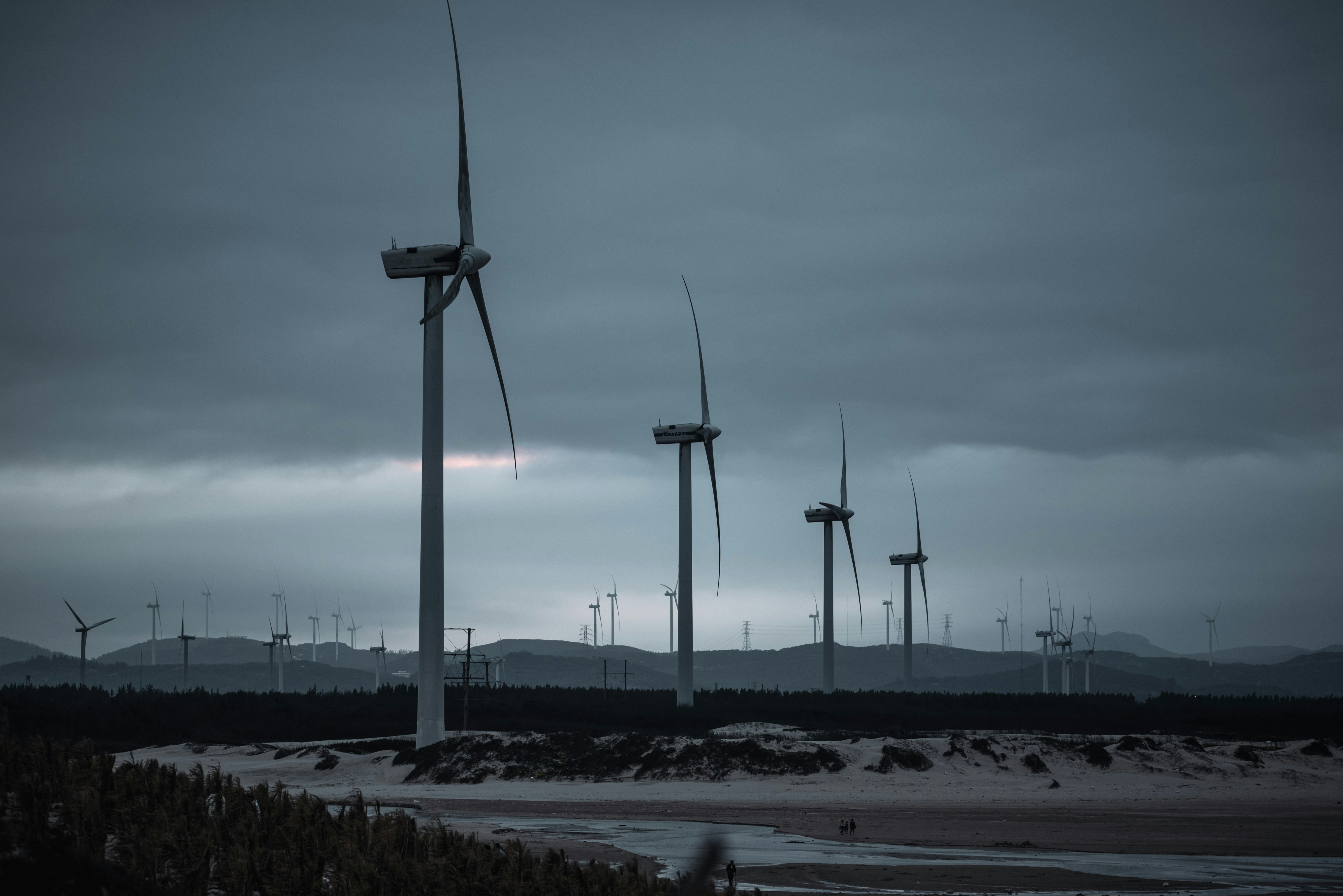 a group of windmills on a cloudy day