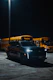 a line of school buses parked in a parking lot