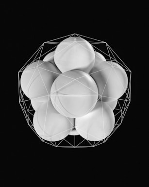 a black and white photo of a bunch of round objects