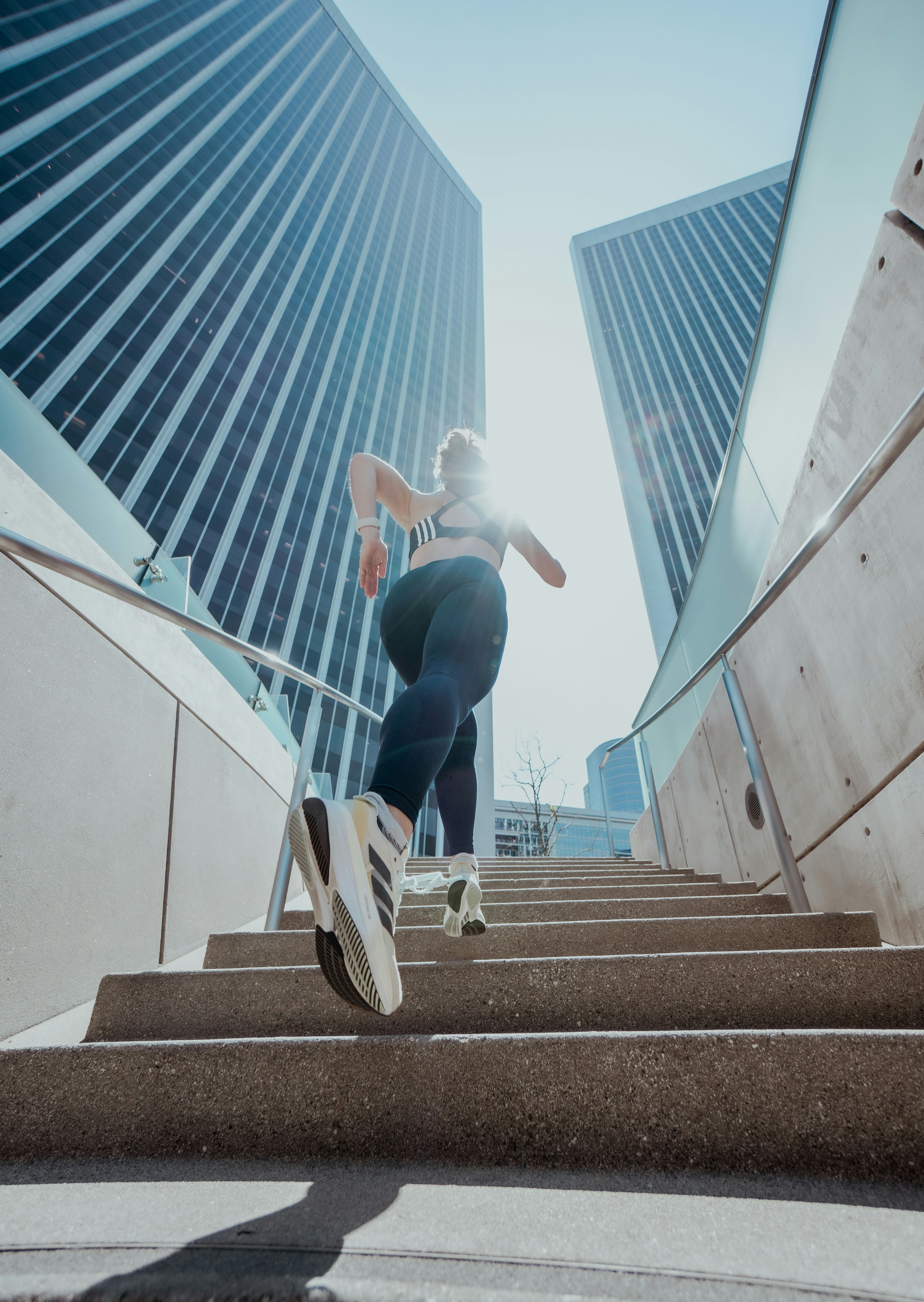 a person riding a skateboard down a flight of stairs