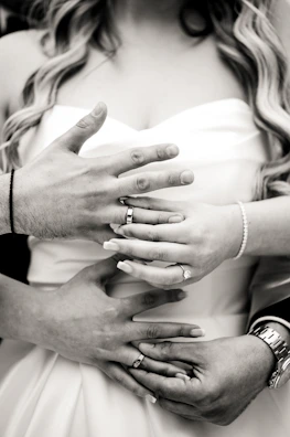 An intimate moment of a traditional Jewish wedding ceremony with family gathered close.