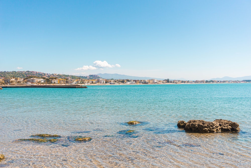 a body of water with a boat in the distance