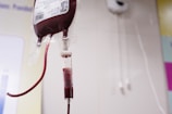 a blood test tube with a blood dropper attached to it