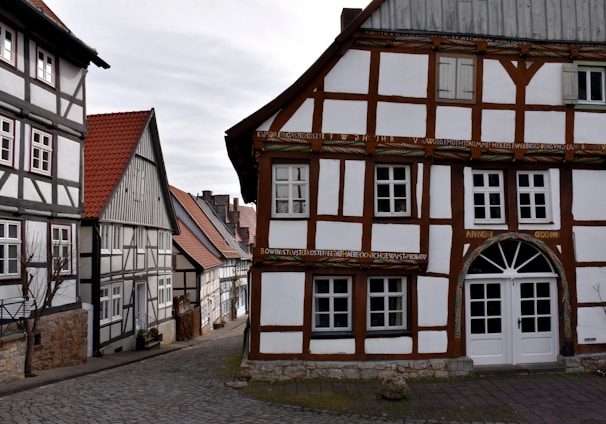 a cobblestone street lined with old buildings