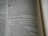 An open page of a book, likely a Bible, with text printed in columns. The section features prominent headings and verse numbers, with some words highlighted in bold.
