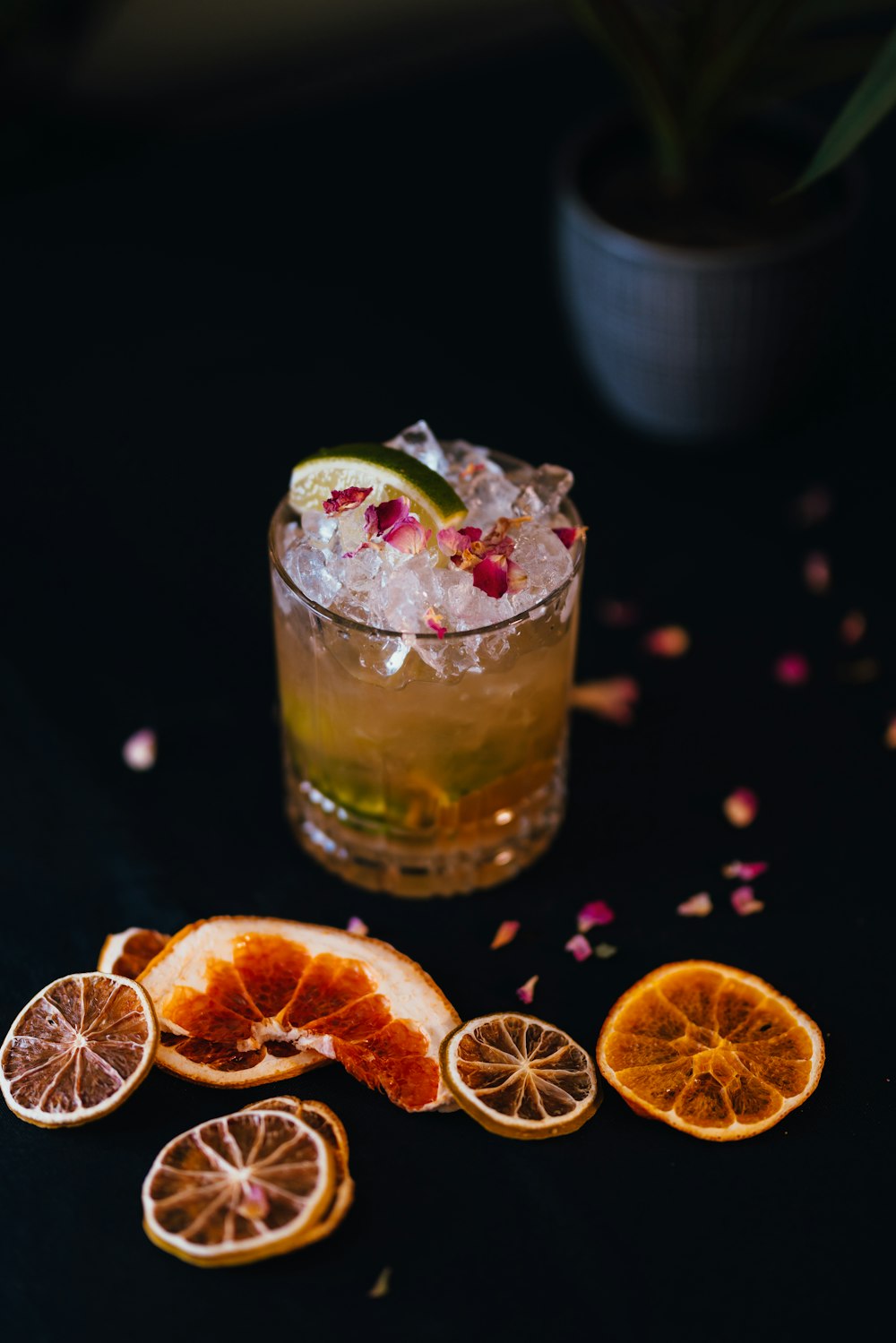 a cocktail with orange slices and a garnish garnish