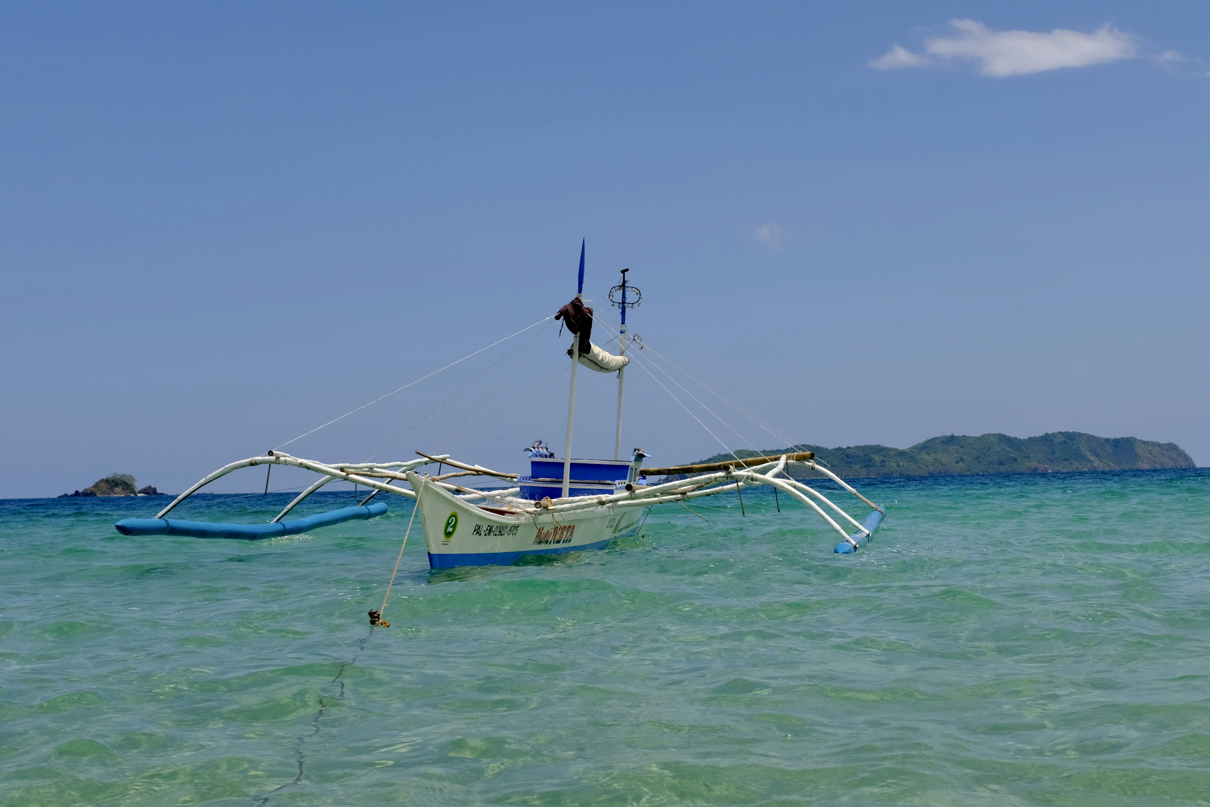 a boat sitting in the middle of the ocean, Boat at sea..