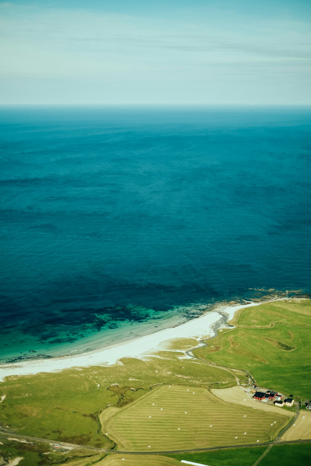 an aerial view of a beach and a body of water