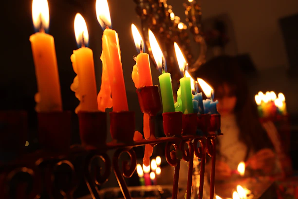 A warm gathering of diverse believers studying scripture together, with a menorah softly glowing nearby.