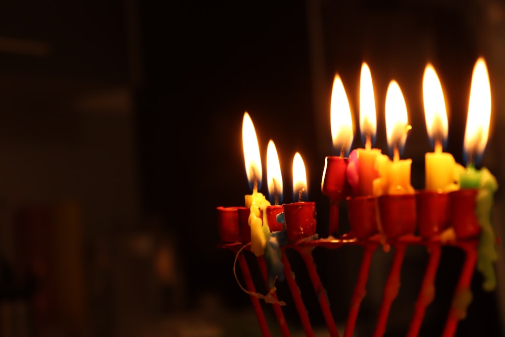 a bunch of candles that are lit up