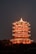 a tall tower lit up in the night sky