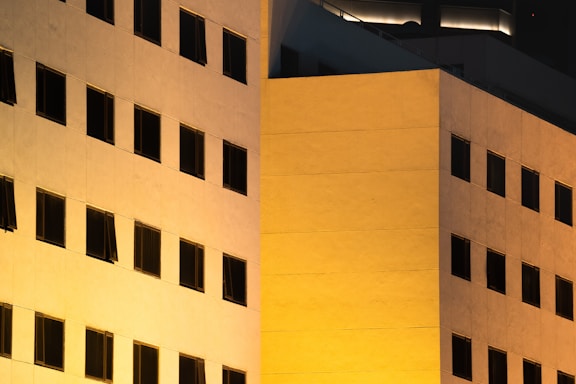 Elegant office building facade in New York City at dusk.