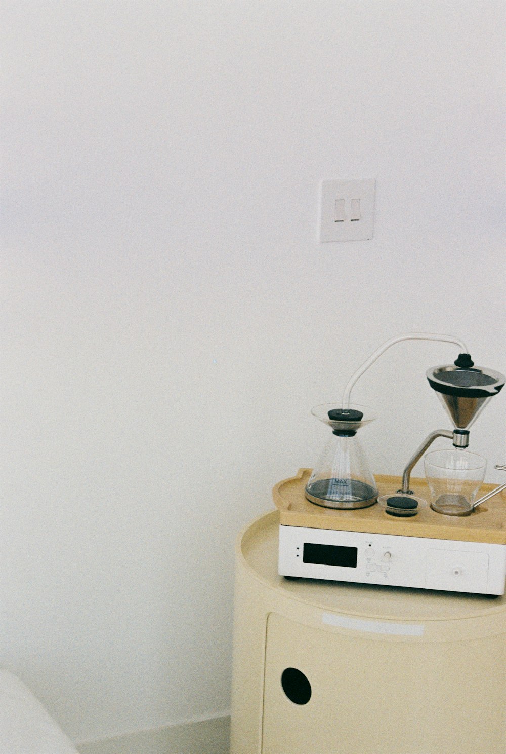 a table with a coffee pot on top of it