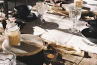 Elegant table linens displayed on a rustic wooden table.