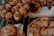 Close-up of freshly baked bread and pastries displayed in a cozy bakery setting.