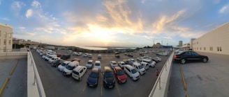 A panoramic view of a car dealership lot.