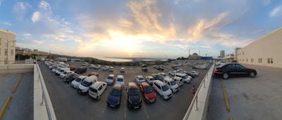 Panoramic security camera capturing a wide-angle view of a parking lot.