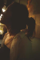 Portrait shot from 'Tante Iki' capturing an intimate moment with warm tones.
