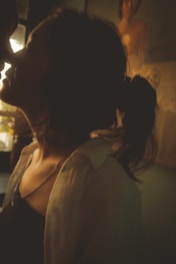 A warm, inviting close-up of a softly lit silhouette suggesting intimacy and allure.