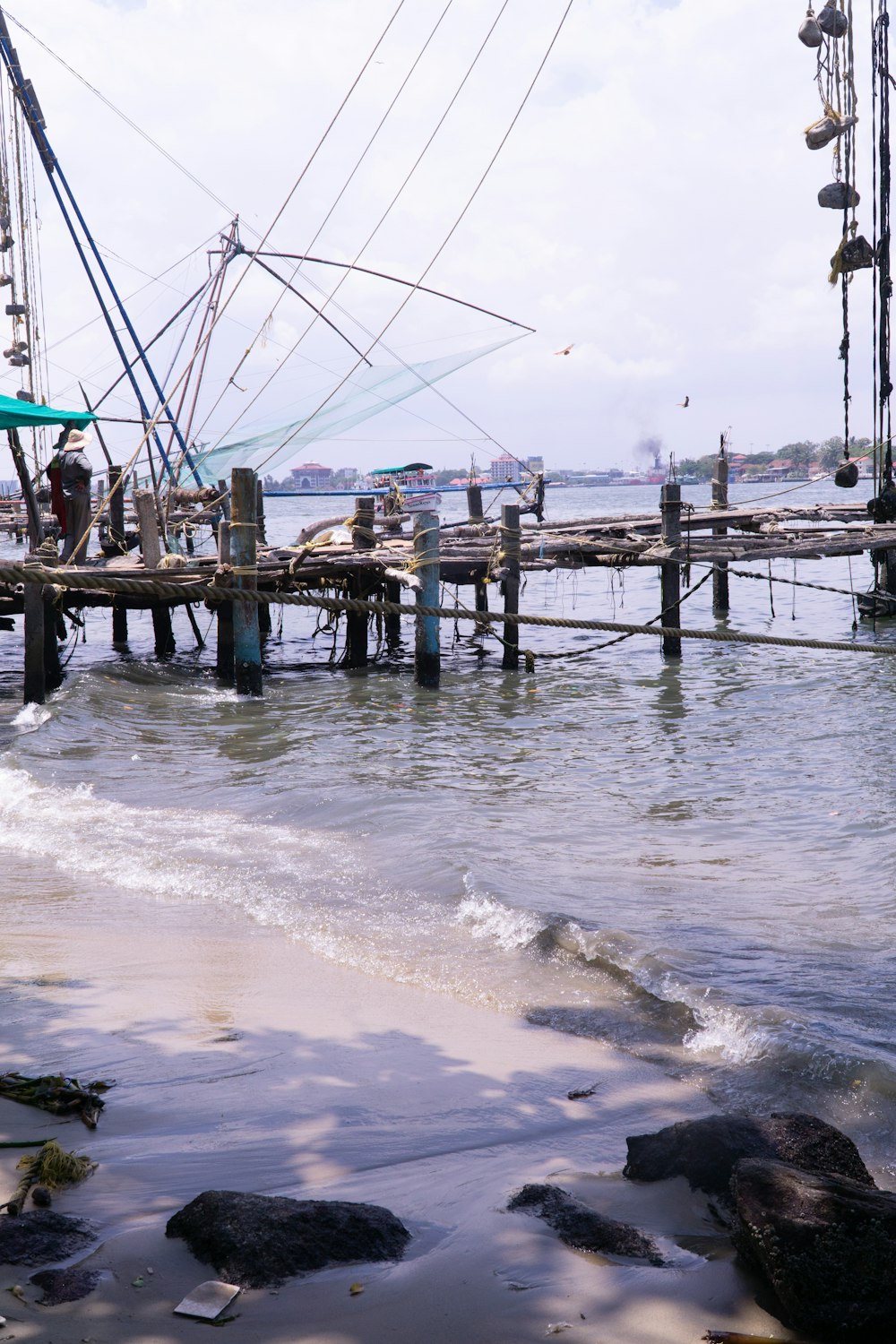 a boat docked at a pier on the water