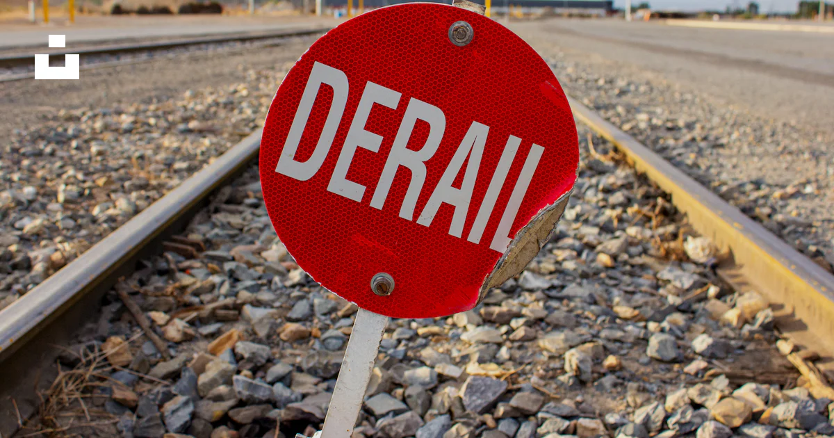 Red Train Stop Sign A red stop sign sitting on the side of a train track photo – Free Sign ...