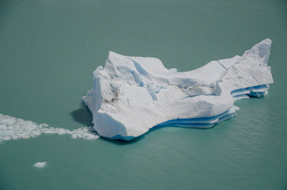 an iceberg floating in a body of water