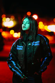 Behind-the-scenes photo of a photoshoot featuring vibrant neon green accents on black backgrounds.
