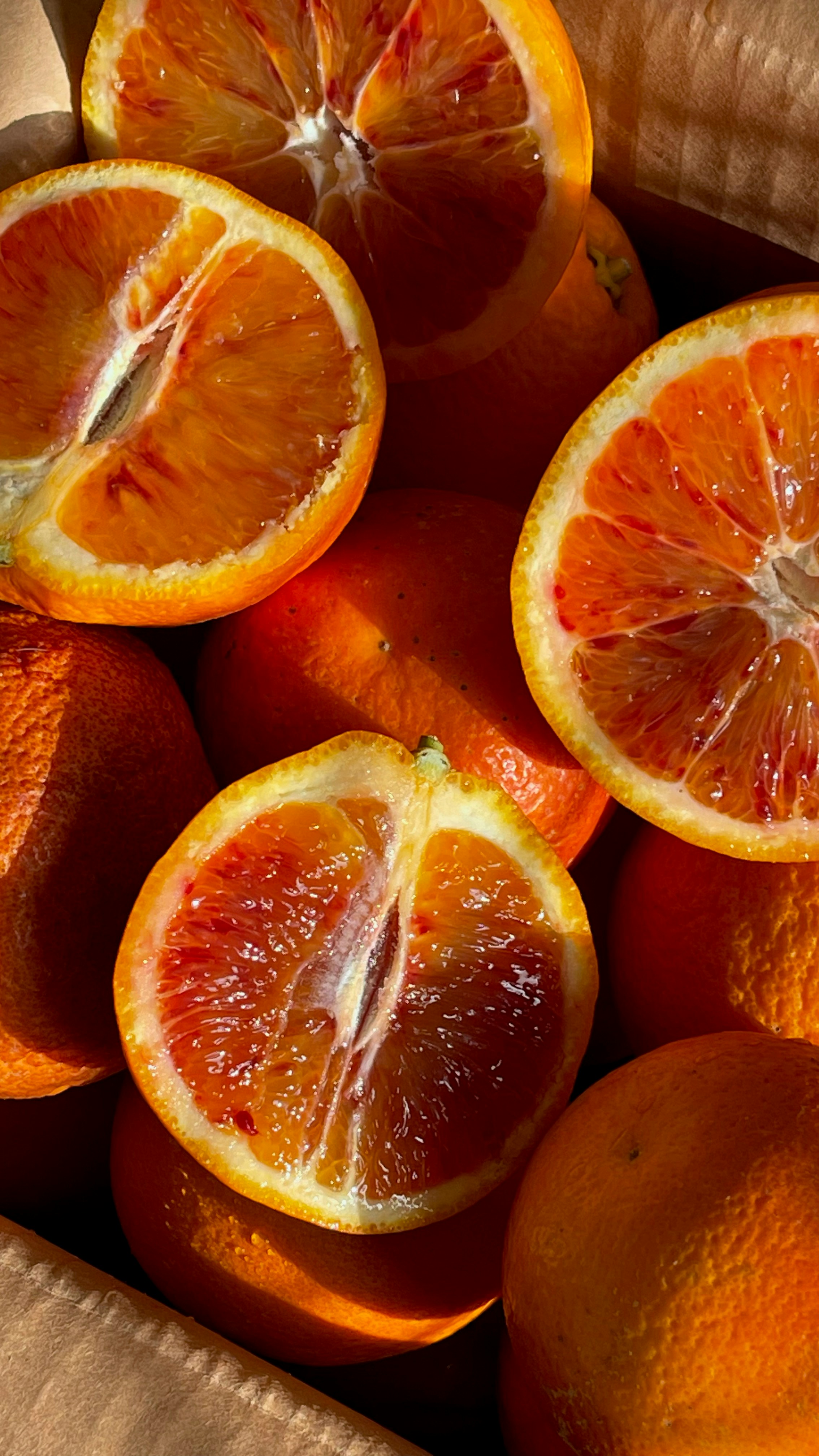 Fresh-cut berry and citrus mix with strawberries, blueberries, and blood orange segments in a box