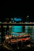 a boat with people on it floating in the water