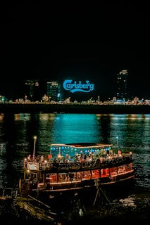 a boat with people on it floating in the water