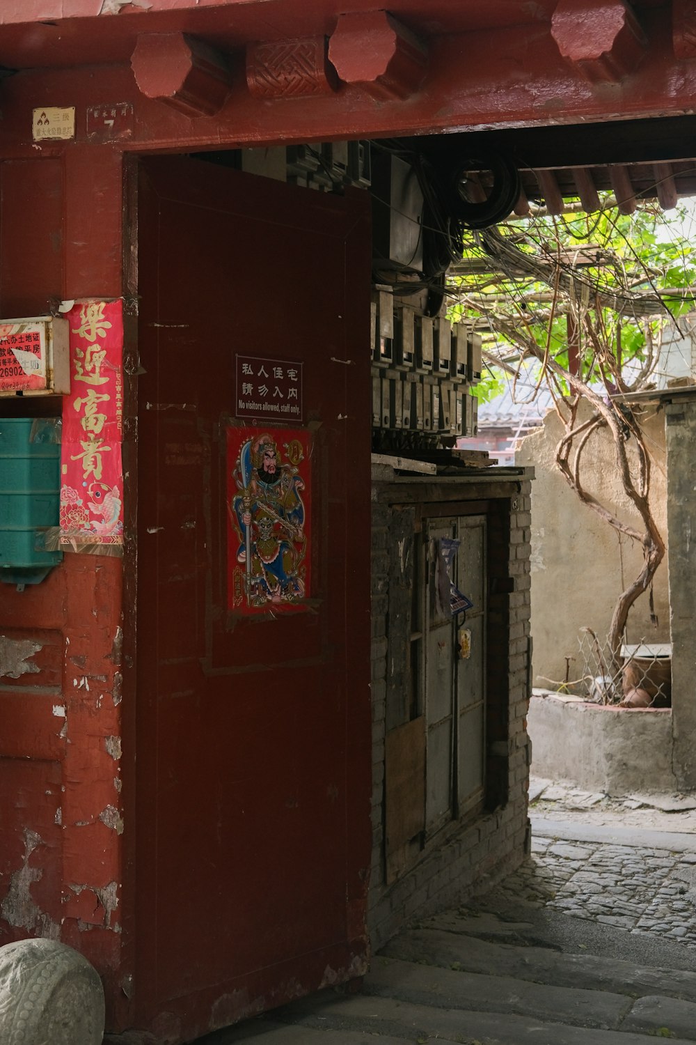 a red building with a sign on the side of it