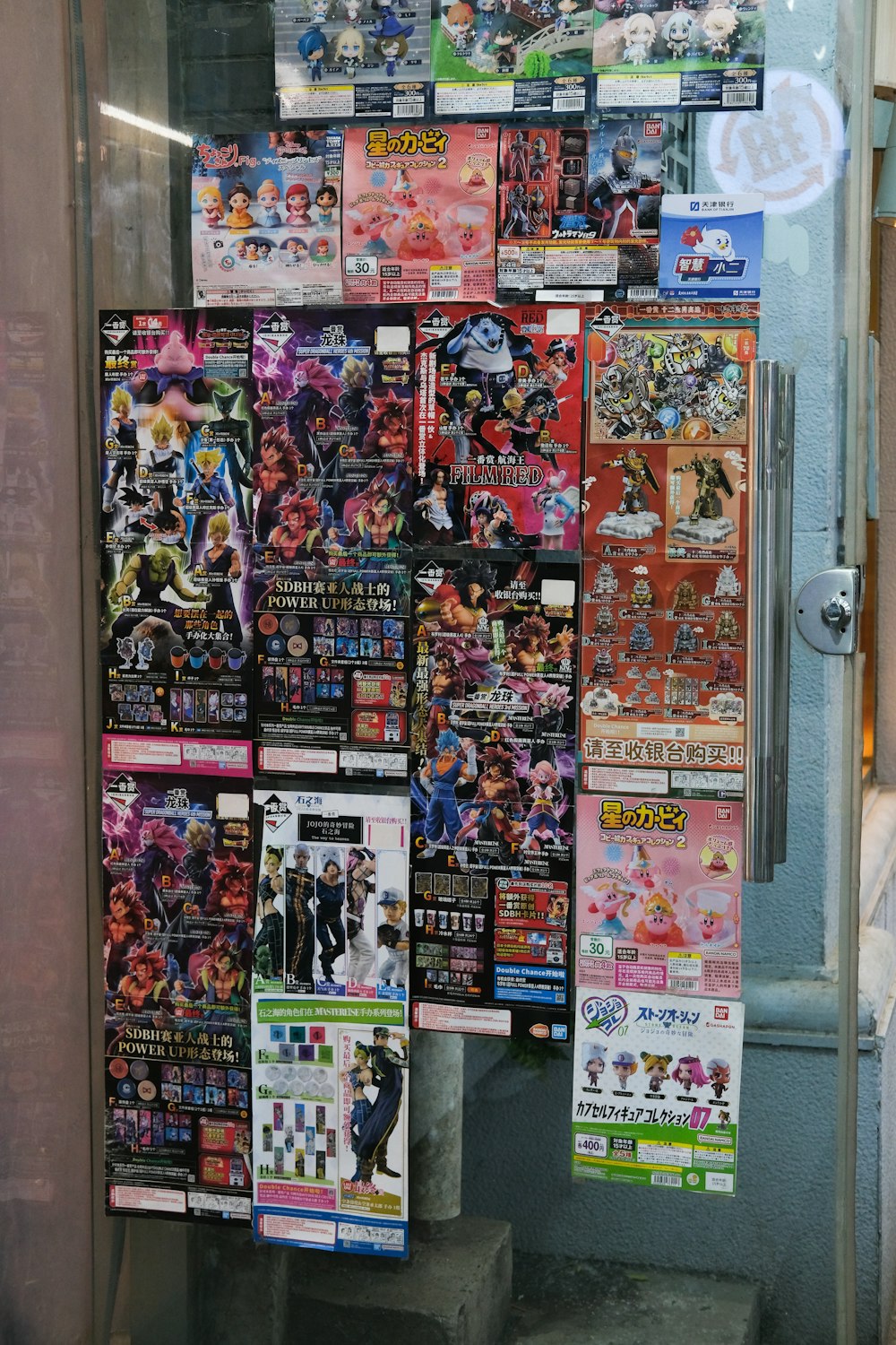 a bunch of posters are hanging on a wall
