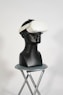 a black mannequin with a white hat on top of it
