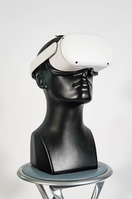 a black mannequin head with a white hat on top of it