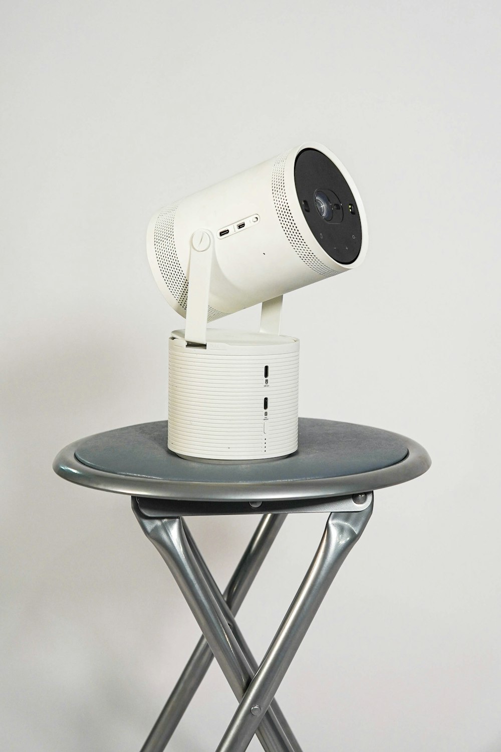 a white camera sitting on top of a table