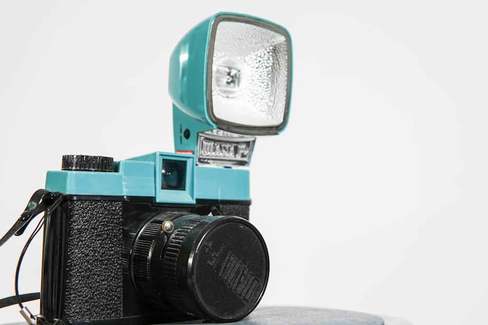 a camera with a flash light attached to it