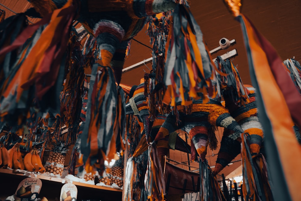 a bunch of ties hanging from a ceiling