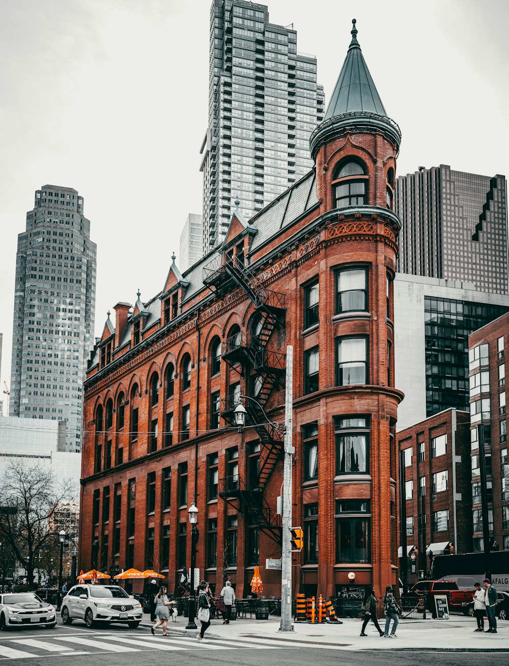 a tall red building with a clock on the top of it