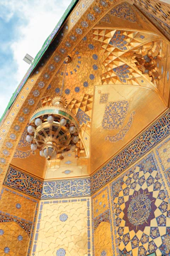A beautifully painted traditional Arabic majlis with intricate ceiling designs.
