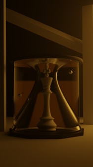 A chess piece is encased within an hourglass, surrounded by soft, dim lighting. The scene is minimalistic with a focus on the central object, which is illuminated from above.